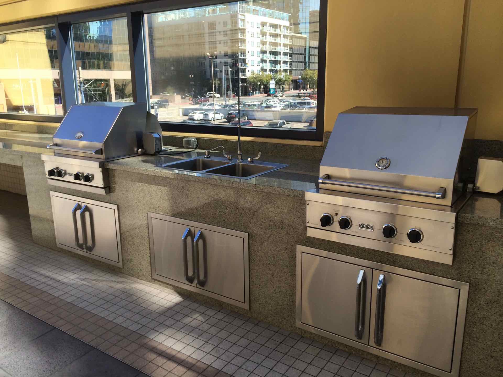 BBQ next to pool deck located on third floor of residential building