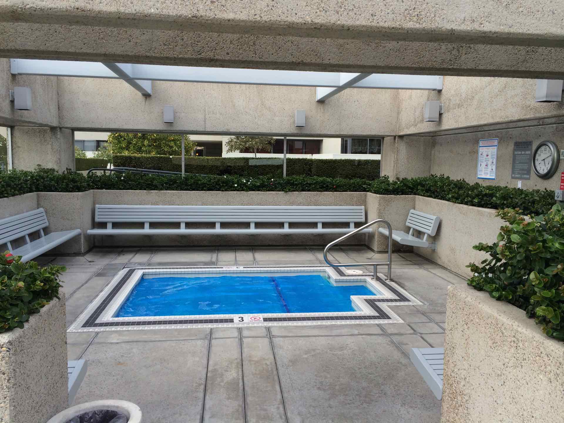 Spa next to pool deck
