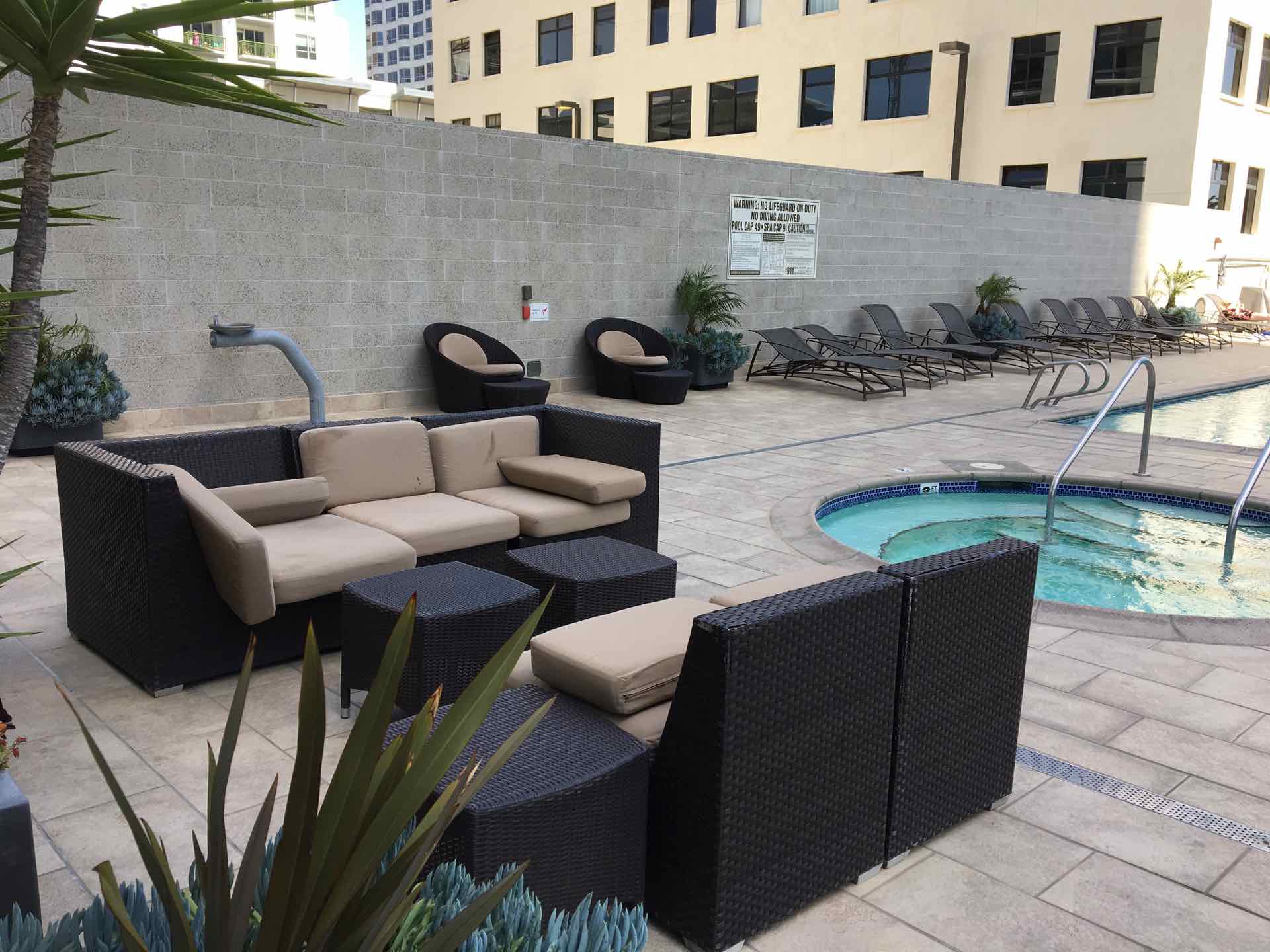 Pool Deck with adjacent seating area and cabanas