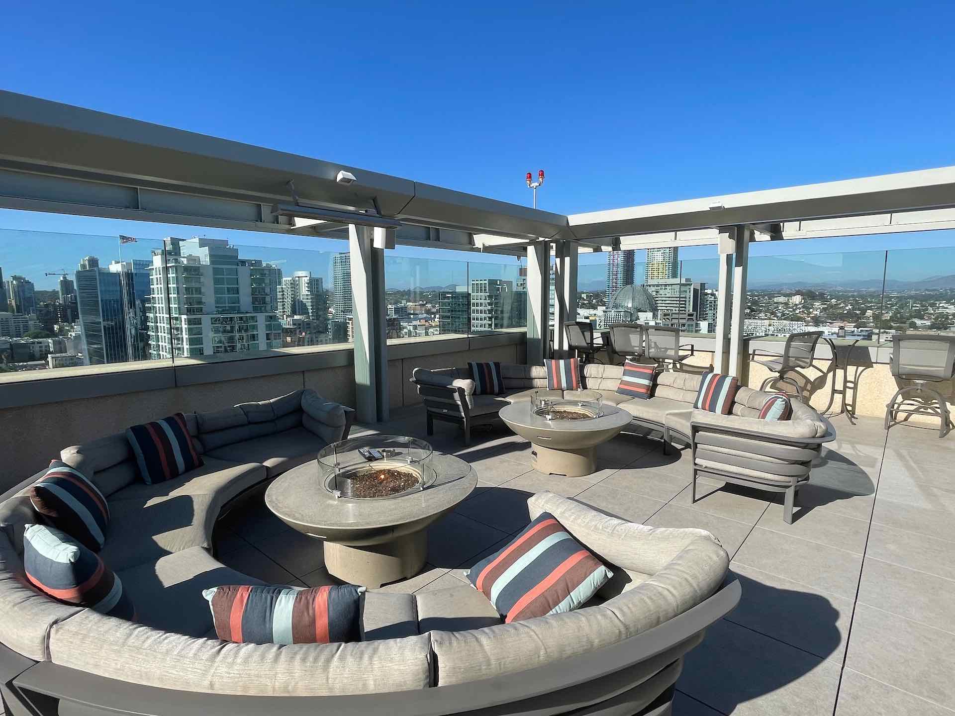 Fire pit seating area next to pool deck in downtown San Diego condo building